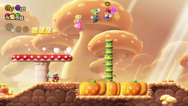 Mario, Luigi, and Peach are surrounded by mushrooms and pumpkins.