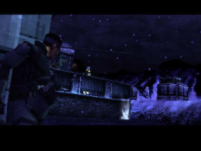Solid Snake surveys the exterior of a military base on Shadow Moses Island in Metal Gear Solid.
